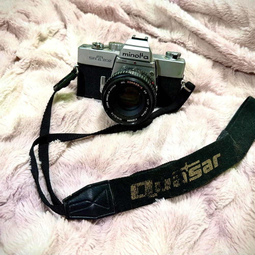 Vintage Silver and Black Film Camera with Manual Controls